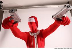 JOEL_ADAMSON CHRISTMAS VILLAIN WITH TWO GUNS